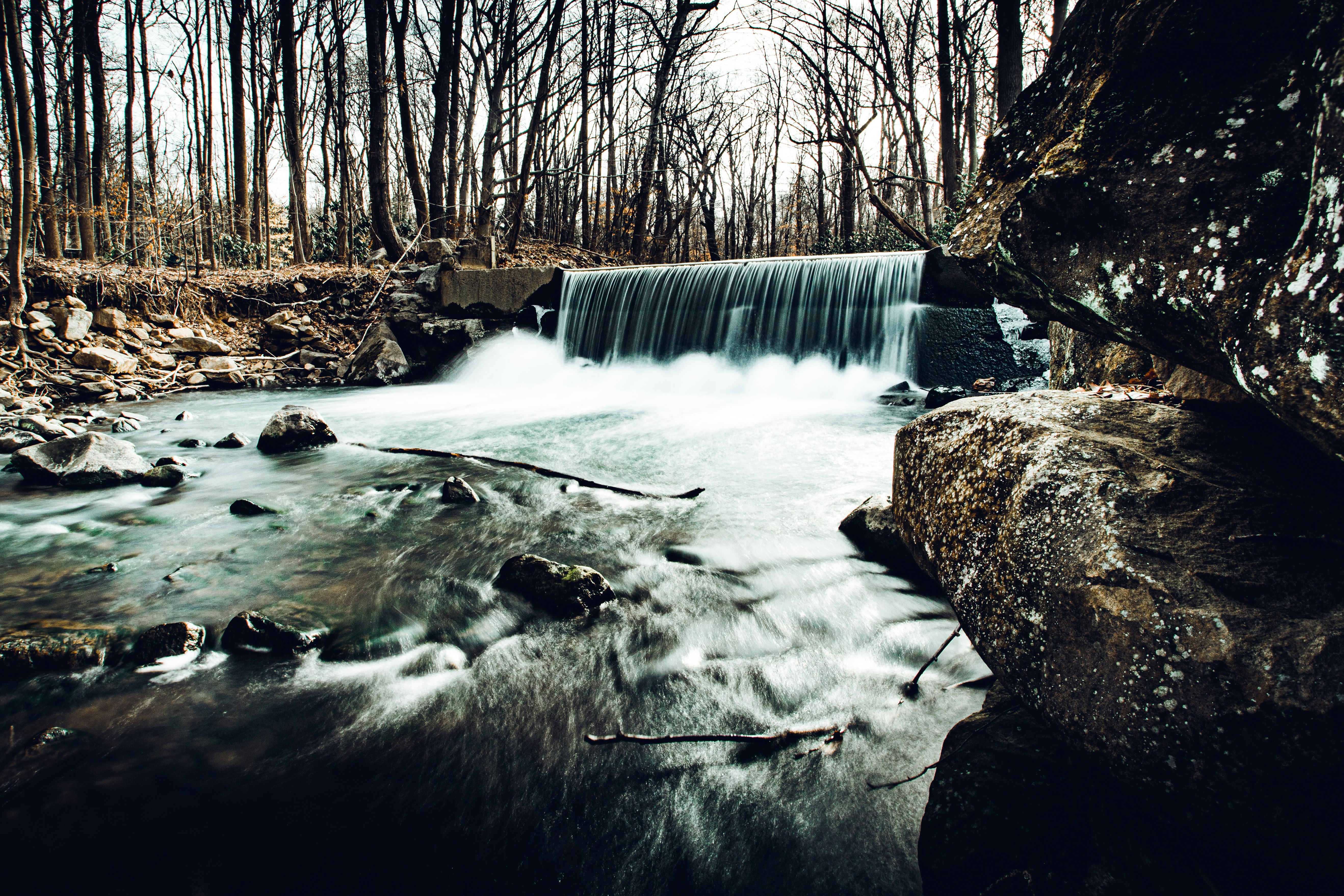 water falls on snow covered ground